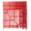 Folded detail of scarf blush pink woven with subtle open check in darker shade then dip dyed in shades of red to subtle effect. Made from wool and cashmere lightweight warm luxurious scarf from Thread Tales company 