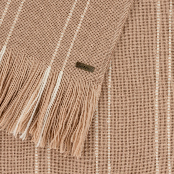 Merino wool scarf from Thread Tales close up to show broken stripe hand threaded by artisans during weaving process