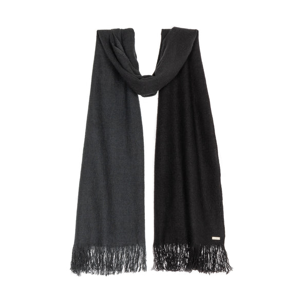Hanging scarf dip dyed in subtle shades of dark grey to almost black. Made from wool, yak and cashmere, a soft and luxurious scarf from Thread Tales company