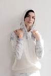 Knitted tie dye hoodie close up with pointelle detail, in pale blue & ivory