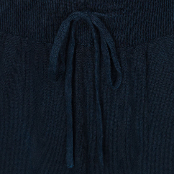 Waist tie detail of soft harem joggers in indigo