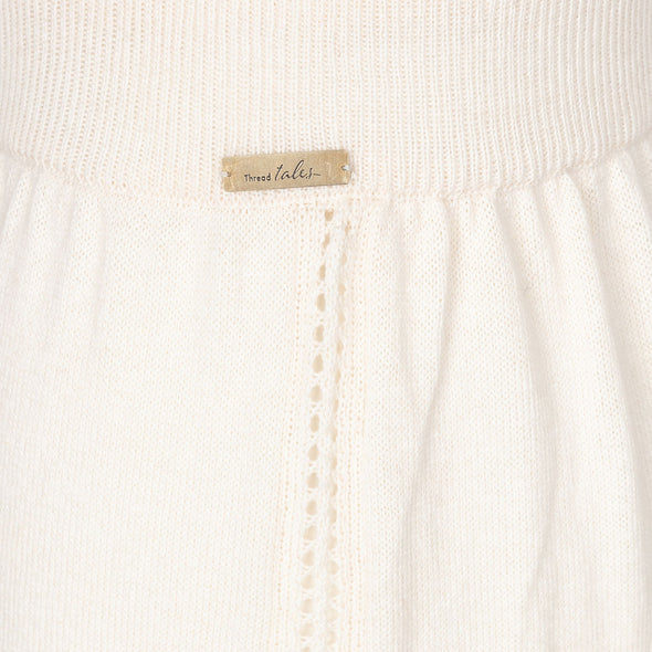 Cream harem joggers showing side pointelle stitching detail 