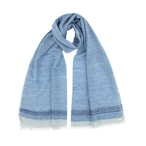 Neck loop of Blue Cashmere and cotton fringed wrap from space-dyed yarn to create a tonal pattern