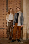 Thread Tales showcases two models in front of ancient door wearing ombre cashmere cardigan and two tone wrap embroidered which can be personalised with initials