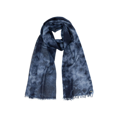 Model wearing navy indigo hand tie dyed scarf made from 100% certified cashmere by Thread Tales company