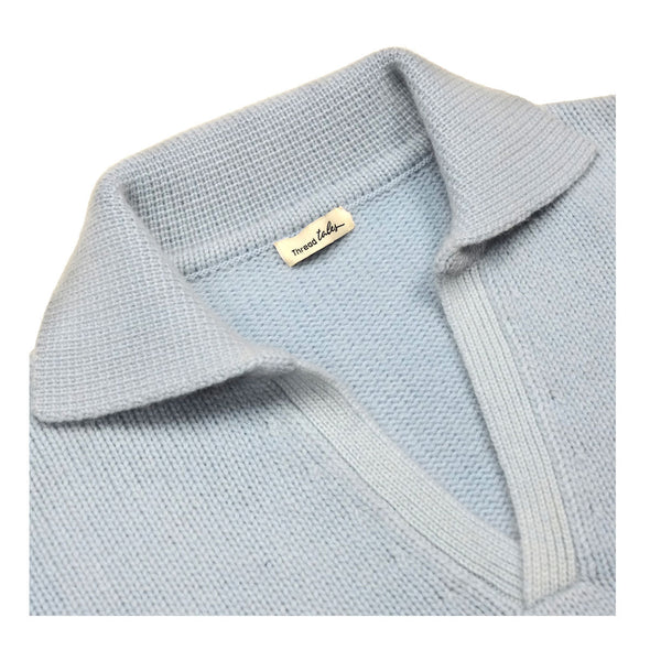Close up of crew neck collar detail., without buttons Sweater in pale, periwinkle blue