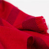 Side detail fringed travel wrap red with crimson striped edge fringed cashmere wool from Thread Tales company