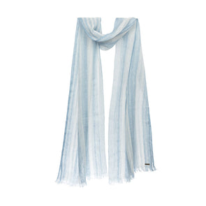 Model draped image of sustainable linen scarf showing striped blue denim scarf from Thread Tales