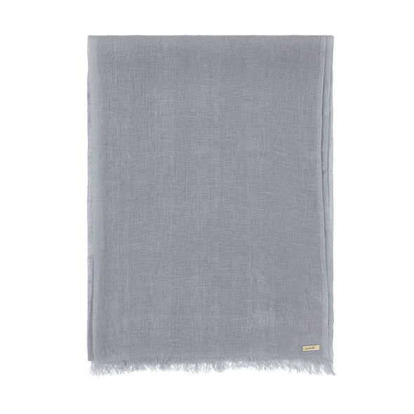 Folded grey linen scarf. Handwoven and sustainably made from eco dyes by Thread Tales