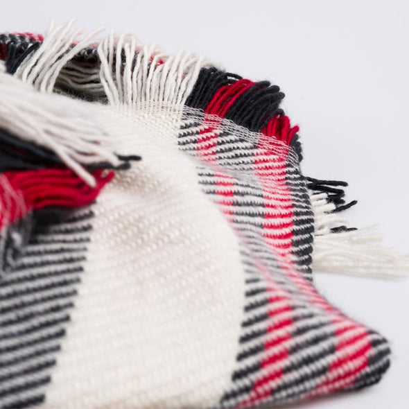 Scarf detail section fringe with red, black white twill stripes merino wool, handwoven heavyweight blanket from Thread Tales company