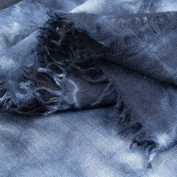 Folded detail of navy indigo hand tie dyed scarf made from 100% certified cashmere by Thread Tales company